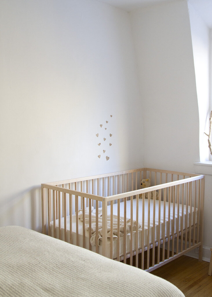 crib in corner of room