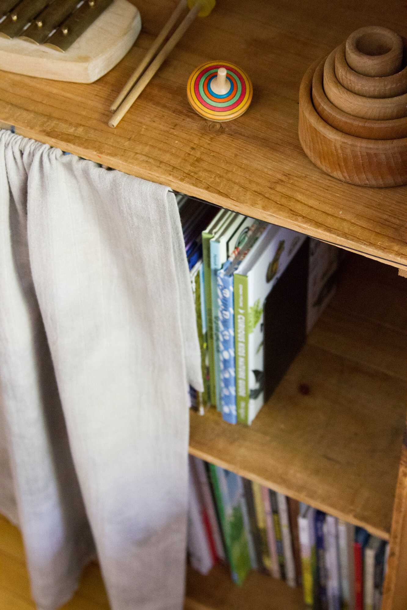 in a small space, cover a bookshelf with a curtain | reading my tea leaves
